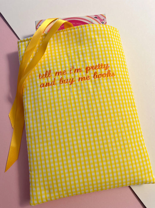 tell me I’m pretty and buy me books (orange text) - embroidered paperback sleeve