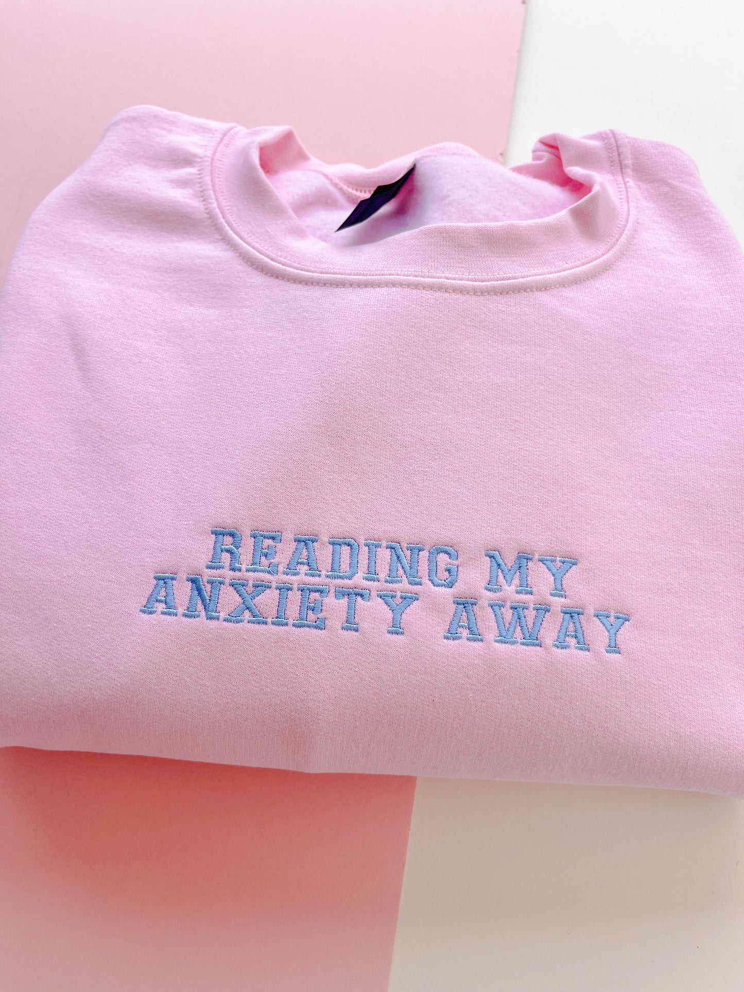 Reading my anxiety away embroidered sweatshirt