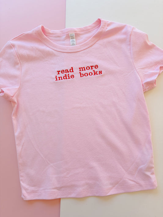 read more indie books embroidered baby tee - Meg the book goblin collab