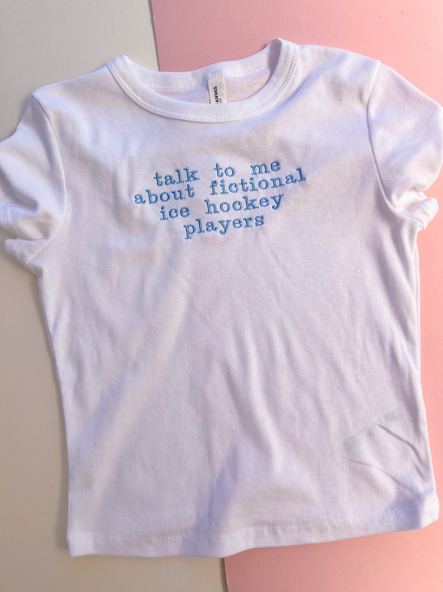 talk to me about fictional ice hockey players embroidered baby tee