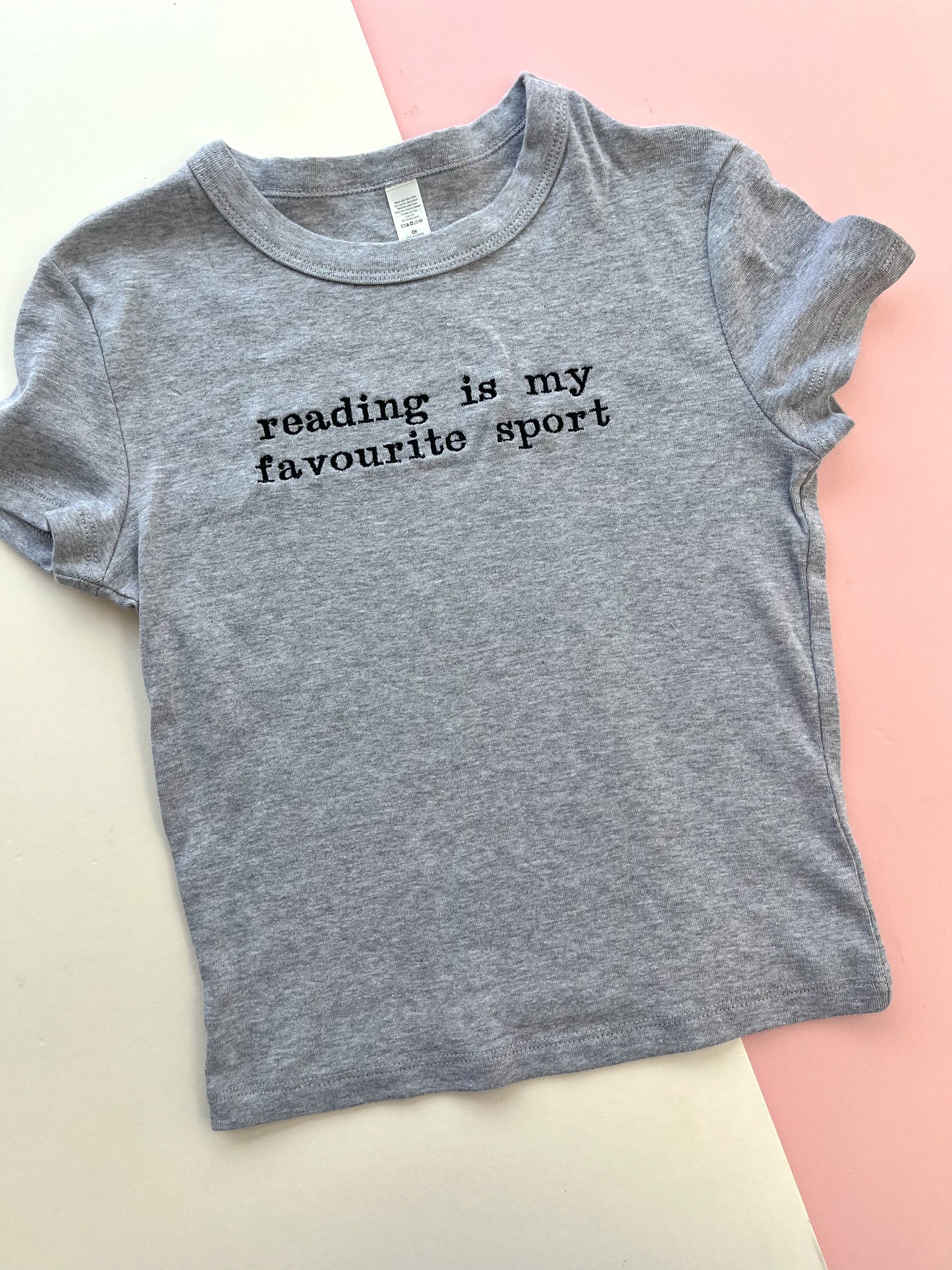reading is my favourite sport embroidered baby t-shirt