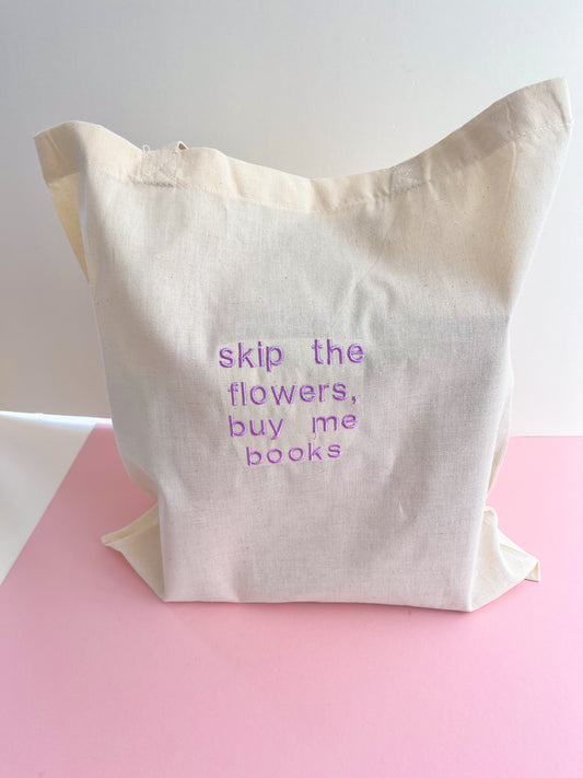 skip the flowers, buy me books embroidered tote bag