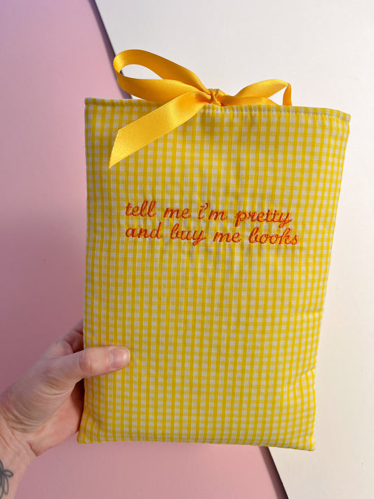 tell me I’m pretty and buy me books (orange text) - embroidered paperback sleeve