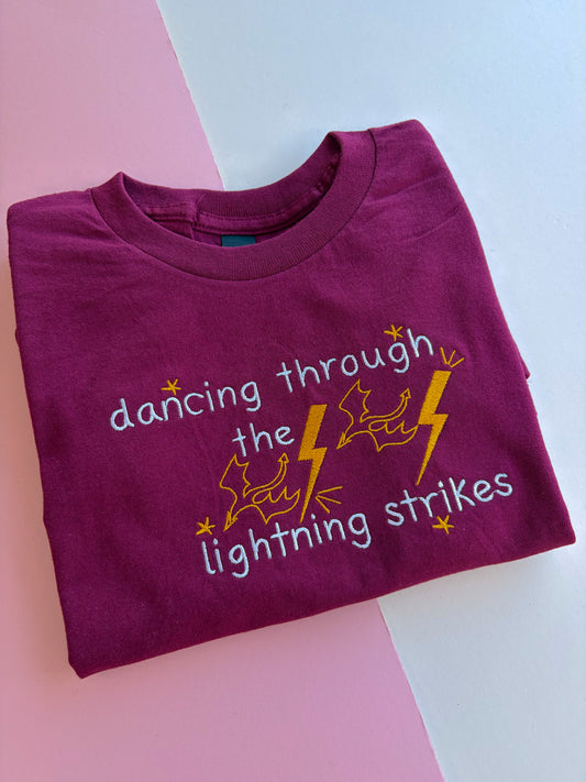 dancing through the lightning strikes embroidered t-shirt