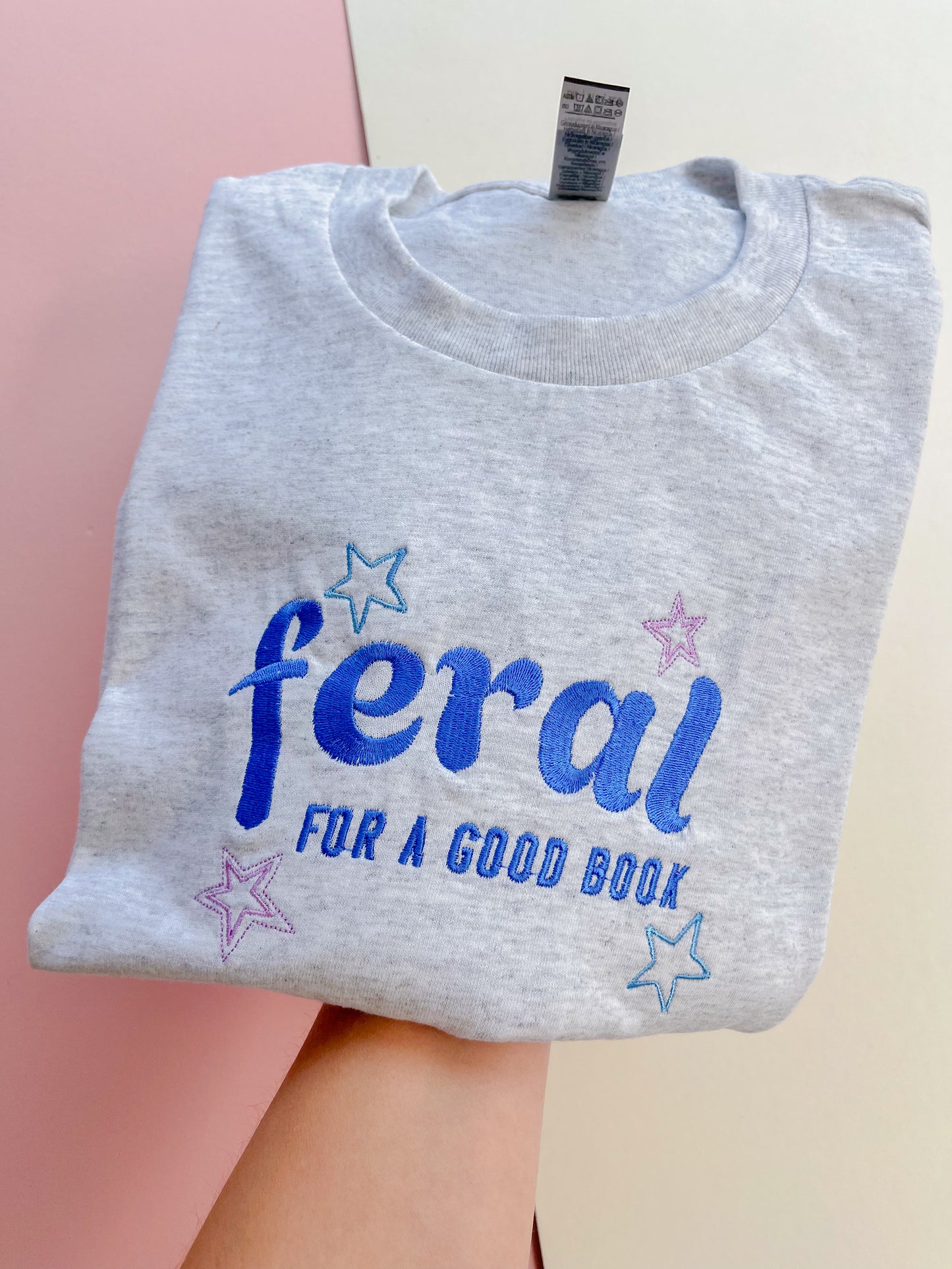 feral for a good book embroidered t-shirt - blue colourway
