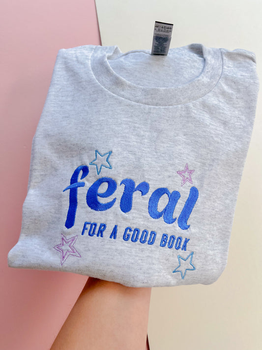feral for a good book embroidered t-shirt - blue colourway