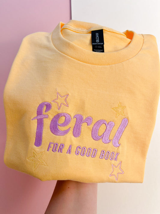 feral for a good book embroidered t-shirt - lilac colourway