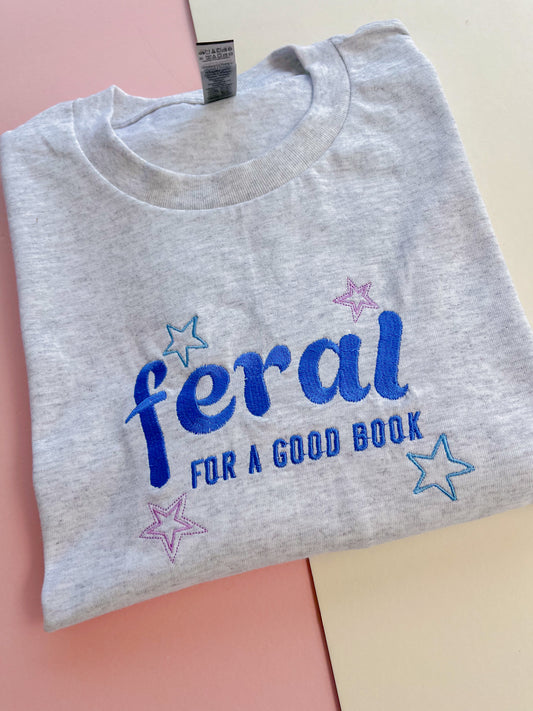 feral for a good book embroidered t-shirt - blue colourway