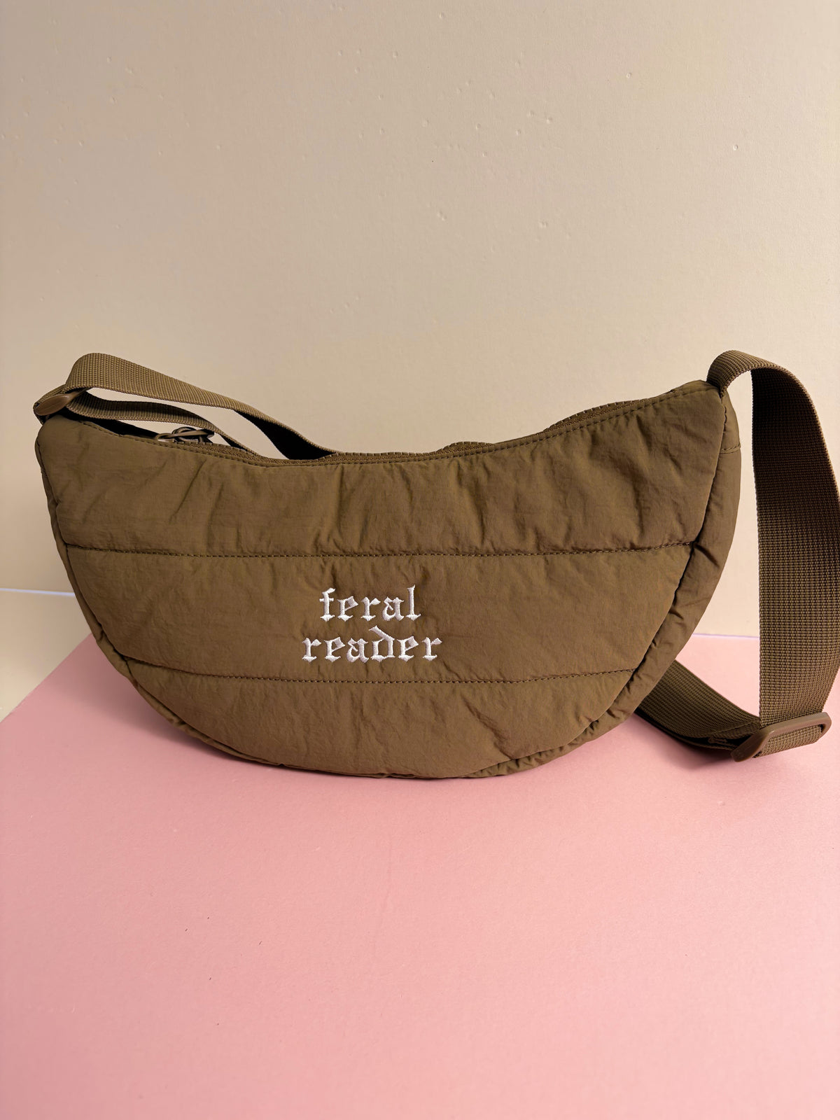 Feral reader quilted shoulder bag