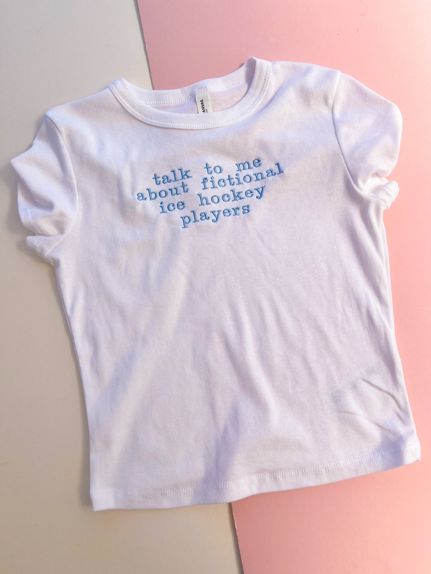 talk to me about fictional ice hockey players embroidered baby tee