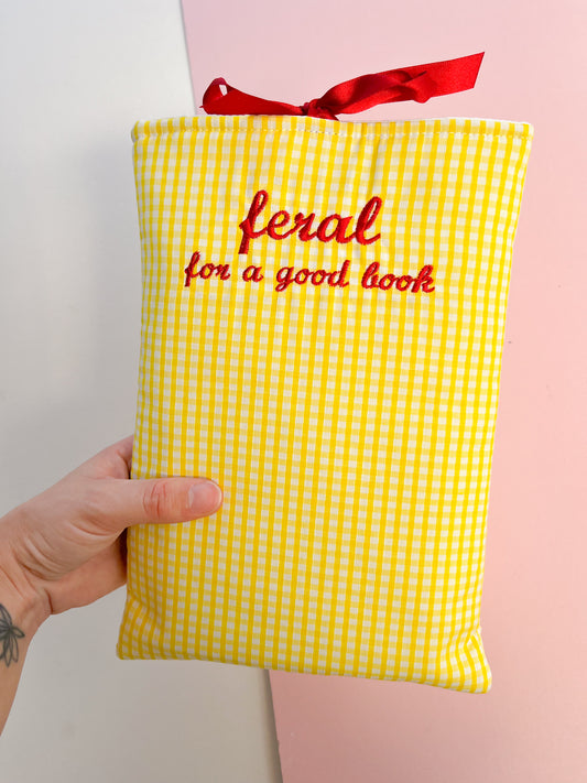 feral for a good book (red text) - embroidered paperback sleeve