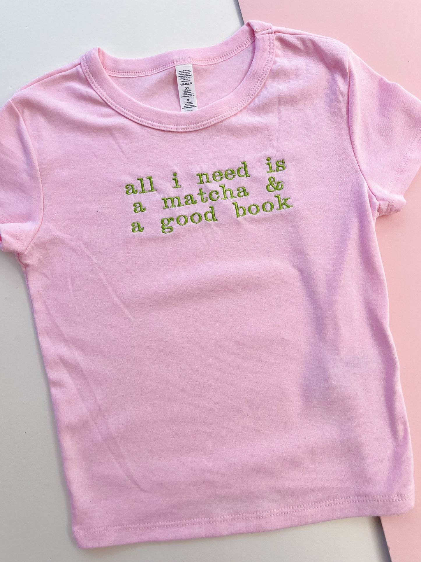 all I need is a matcha & a good book embroidered baby tee